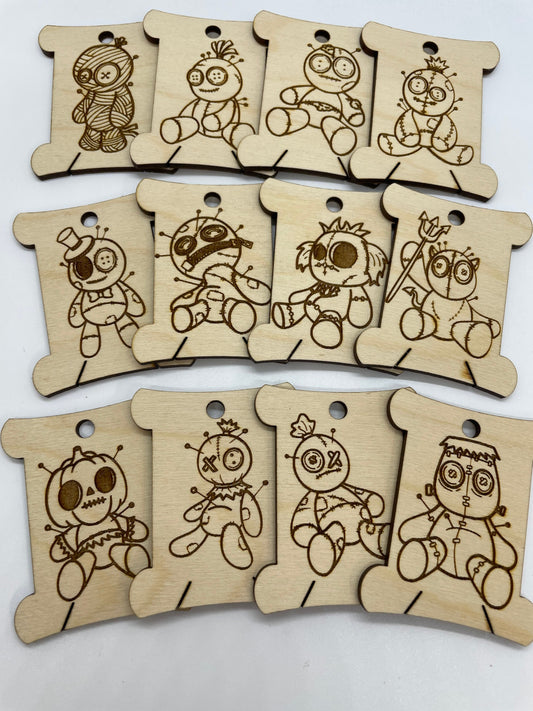 Set of wooden tags with cartoon character designs on a white background