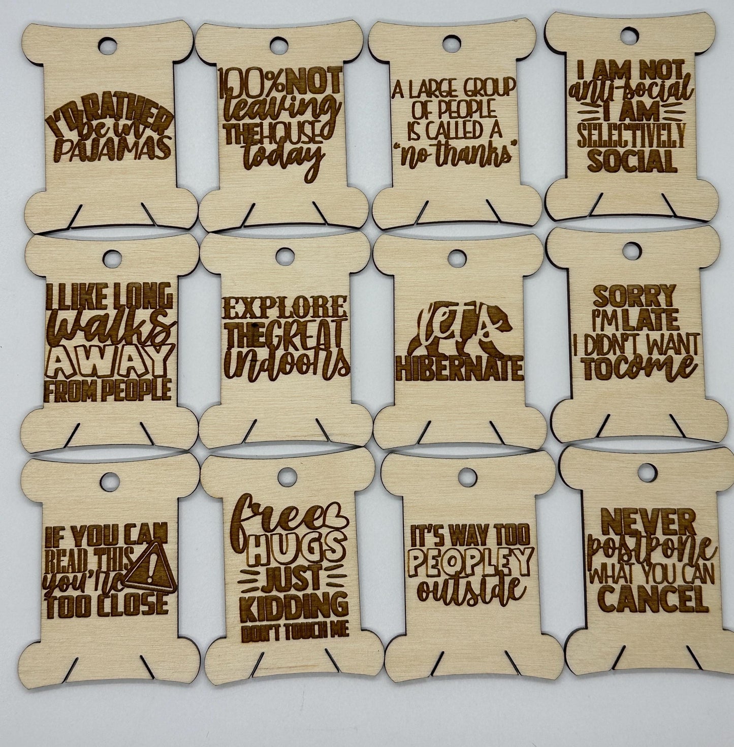 Set of wooden tags with humorous text on a white background